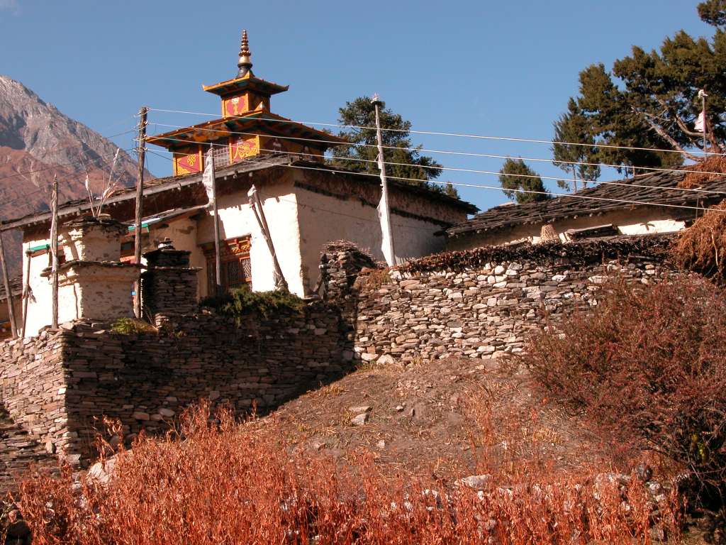 Manaslu 07 16 Sama Gompa Kargyu Chholing (Sama) gompa is a white-walled building with an elaborately decorated roof spire, surrounded by about thirty small houses in which monks and nuns live who study there under a head lama.